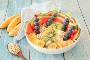 Bowl of oats and fruits on a table