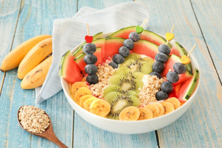 Bowl of oats and fruits on a table