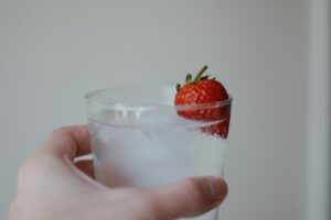 Glass of infused water with strawberry in