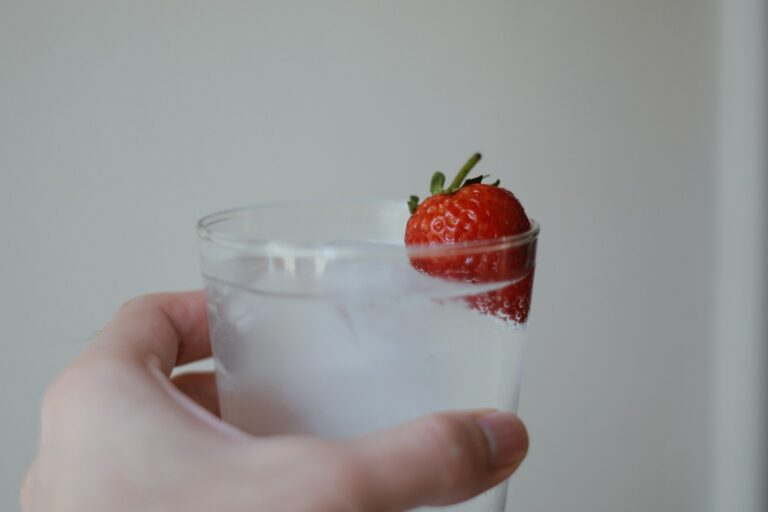 Glass of infused water with strawberry in